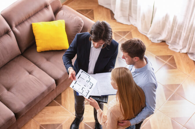 above view of real estate agent showing house plan 2022 12 16 08 22 27 utc 1